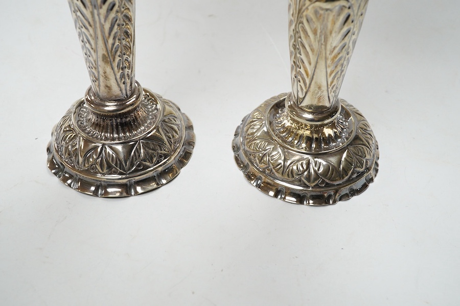 A pair of late Victorian repousse silver trumpet vase, Charles Boyton II, London, 1892/3, 20.3cm, weighted. Condition - poor